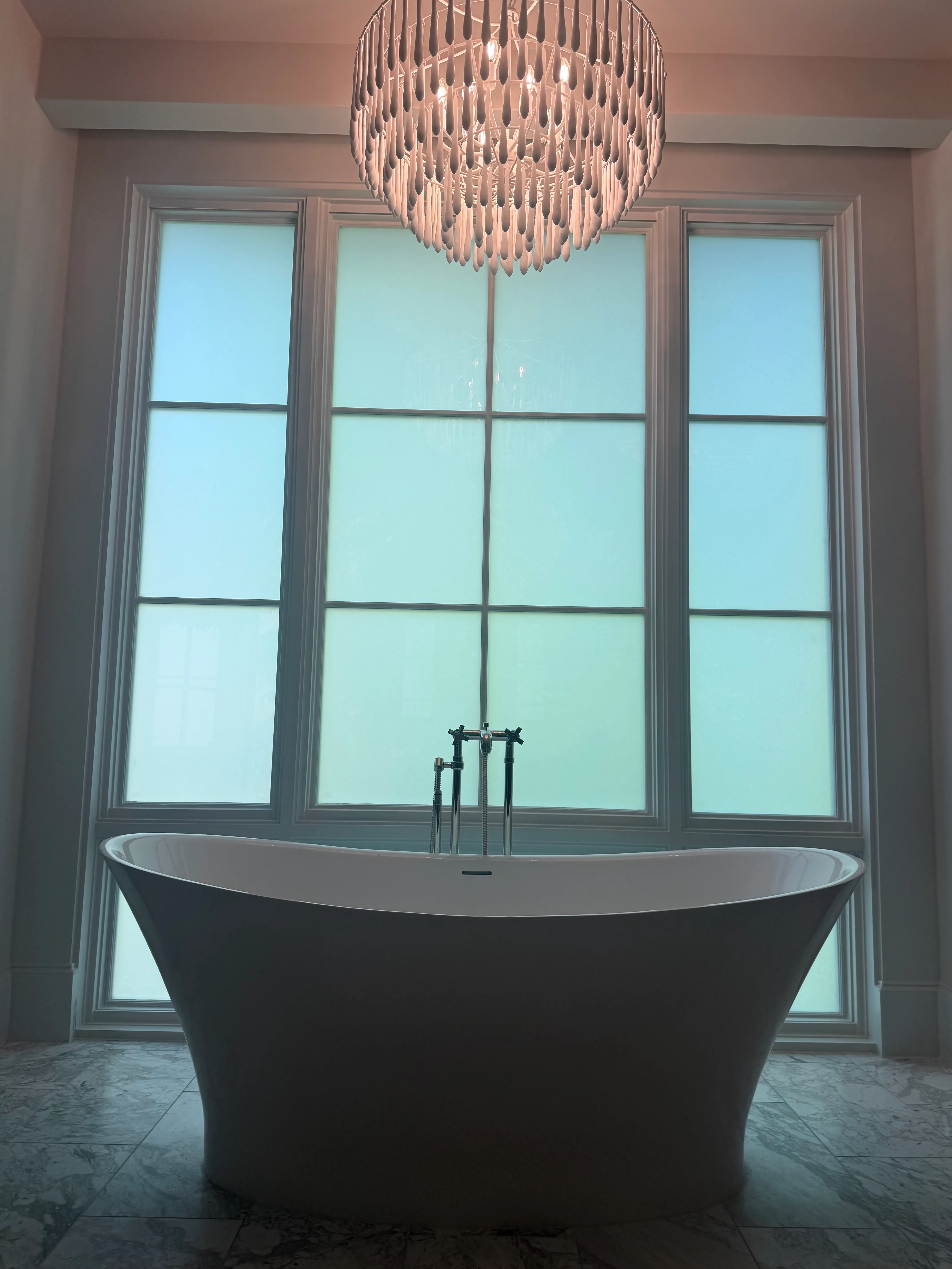 The same arched bath window switched to frosted for privacy